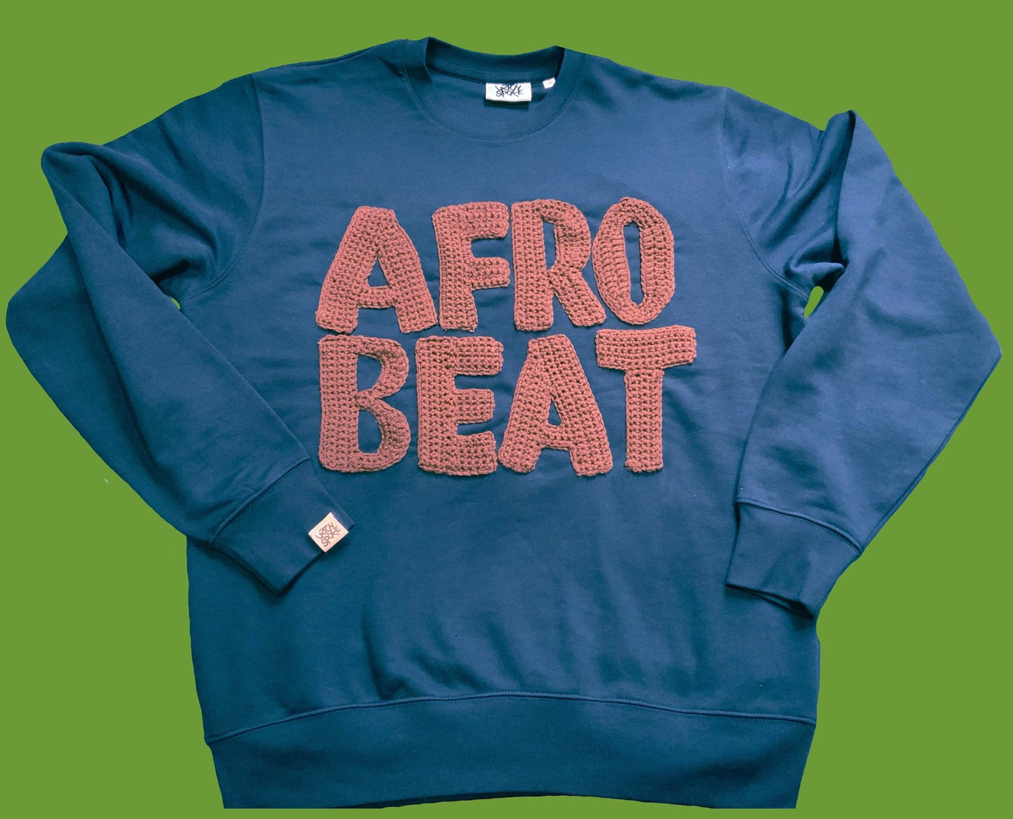 blue sweatshirt with brown Afrobeat crocheted letters