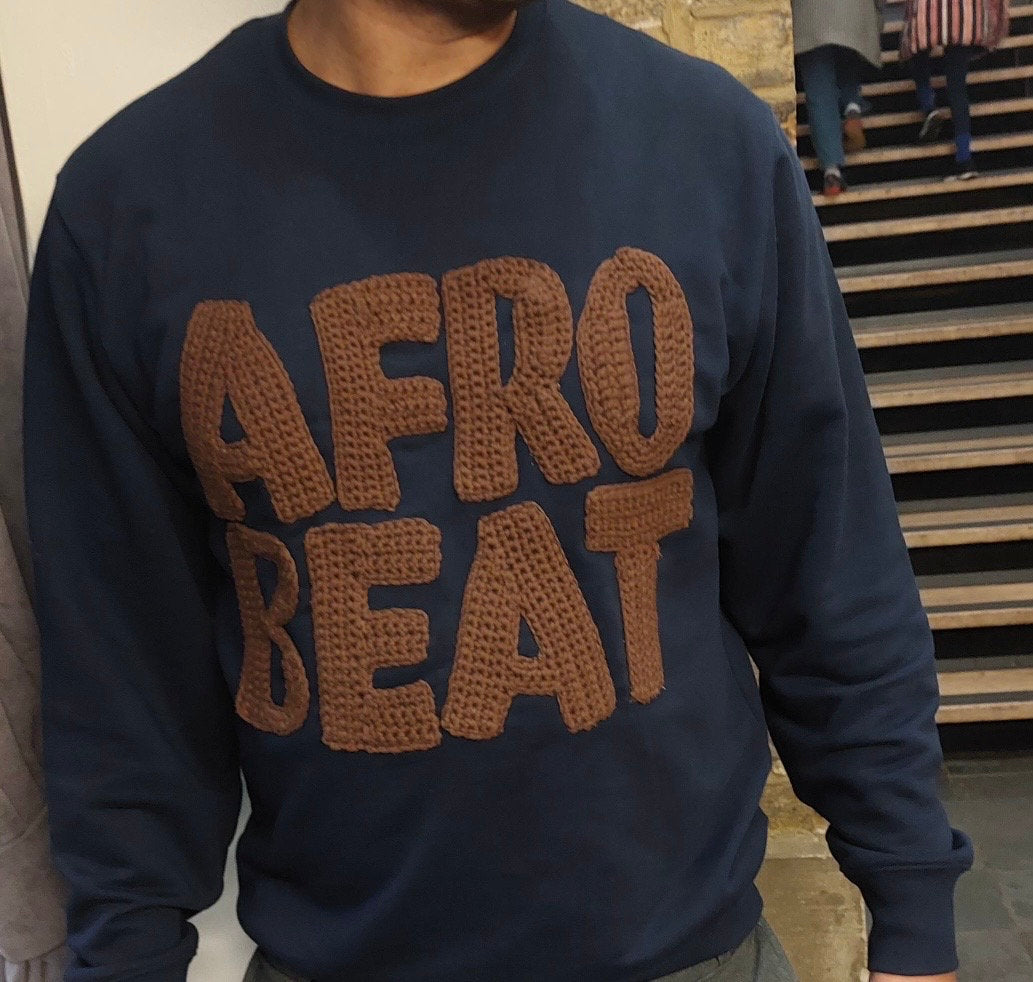 Side view of the sweatshirt, showing the fit and quality.
